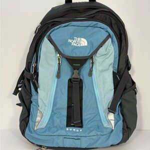 The North Face Surge Backpack light blue, gray, and black color panels